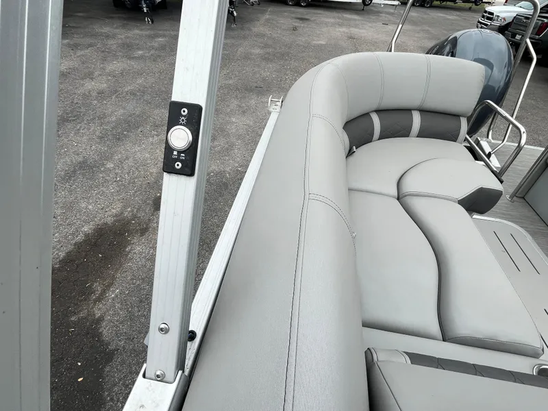 Slide: The Image of 2022 Bennington 23LTFB pontoon boat with gray seating and control panel. - 20