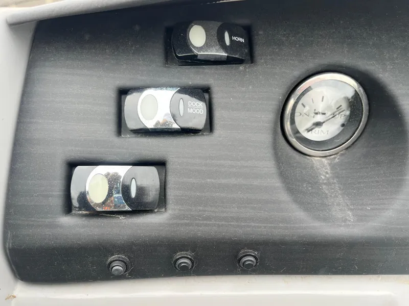 Slide: The Image of Control panel of 2022 Bennington 23LTFB boat with switches and gauge. - 27