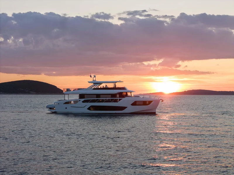 Slide: The Image of Luxury Absolute NAVETTA 75 yacht cruising at sunset, 2024 model. - 16
