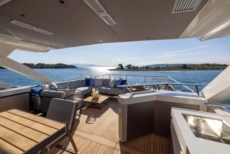 Slide: The Image of Luxurious 2024 Absolute NAVETTA 75 yacht deck with elegant seating and ocean view. - 35