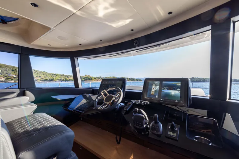 Slide: The Image of 2024 Absolute NAVETTA 75 yacht helm with modern navigation technology and panoramic views. - 46