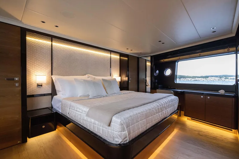 Slide: The Image of Luxurious bedroom interior of 2024 Absolute NAVETTA 75 yacht with modern design and scenic window view. - 48