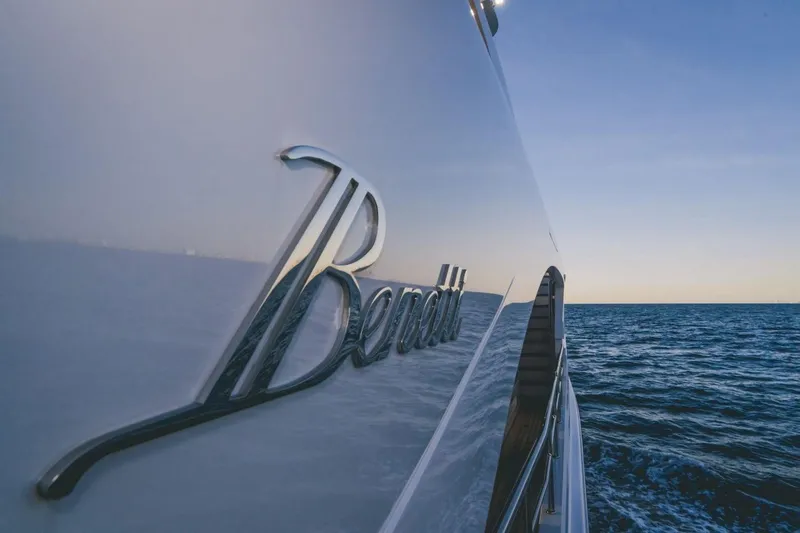 Slide: The Image of Benetti Delfino 95 yacht on open sea, 2020 model, side view at sunset. - 18