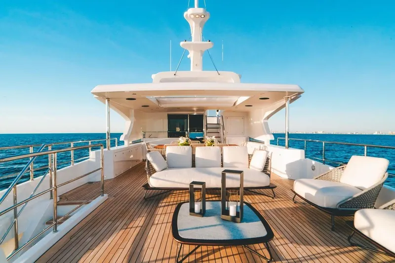 Slide: The Image of Luxurious 2020 Benetti Delfino 95 yacht deck with elegant seating and ocean view. - 20