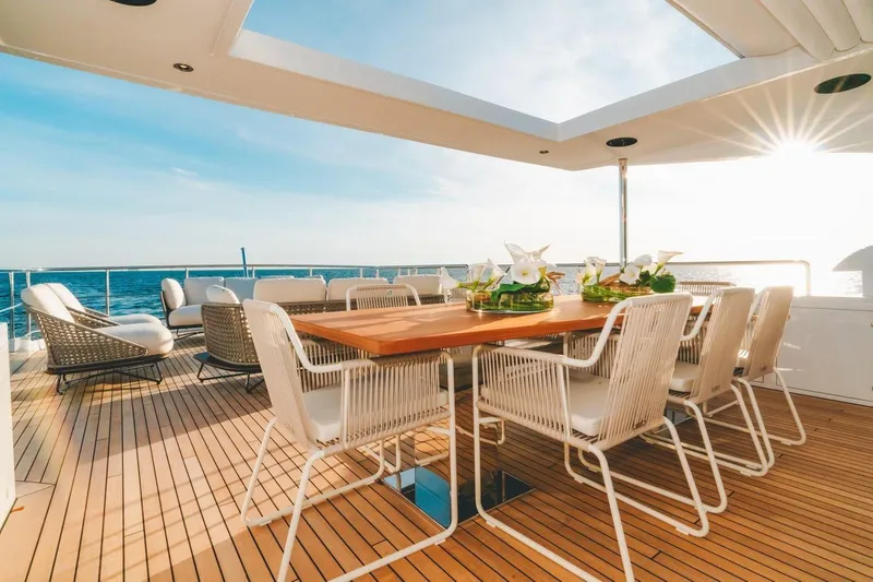 Slide: The Image of Luxurious deck of 2020 Benetti Delfino 95 yacht with elegant dining setup. - 21