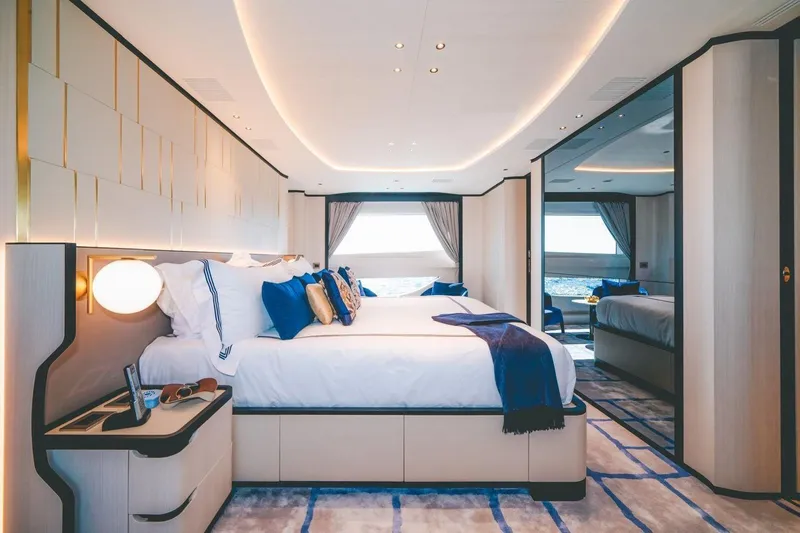 Slide: The Image of Luxurious bedroom interior of 2020 Benetti Delfino 95 yacht with elegant decor and ocean view. - 34