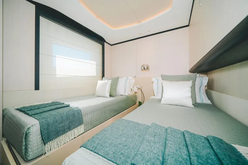 Slide: The Image of Luxurious twin bedroom on 2020 Benetti Delfino 95 yacht, featuring modern design and cozy bedding. - 42
