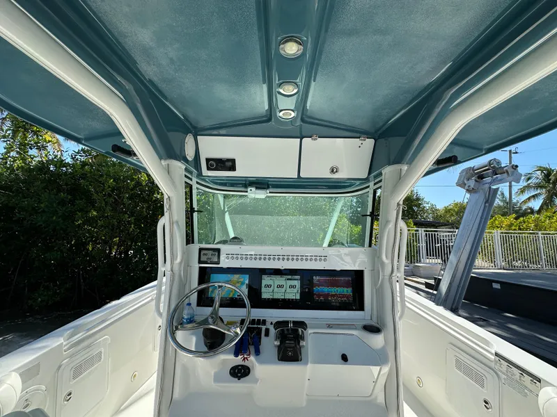 Slide: The Image of 2008 Everglades 350 CC boat cockpit with steering wheel and navigation displays. - 18