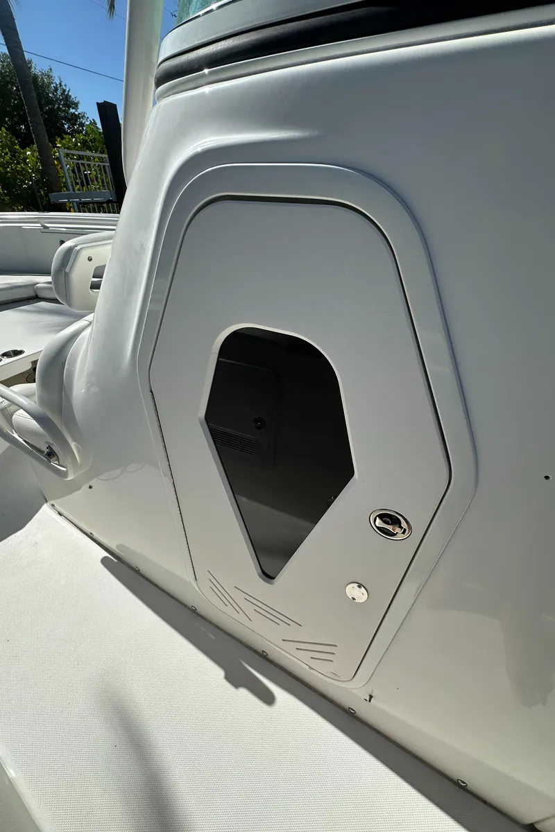 Slide: The Image of 2008 Everglades 350 CC boat console detail with storage compartment. - 29