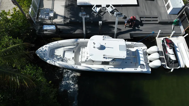 Slide: The Image of Aerial view of 2008 Everglades 350 CC boat docked beside a wooden pier. - 3