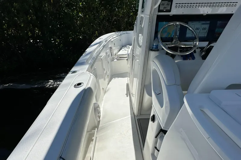 Slide: The Image of 2008 Everglades 350 CC boat interior with steering wheel and seating. - 30