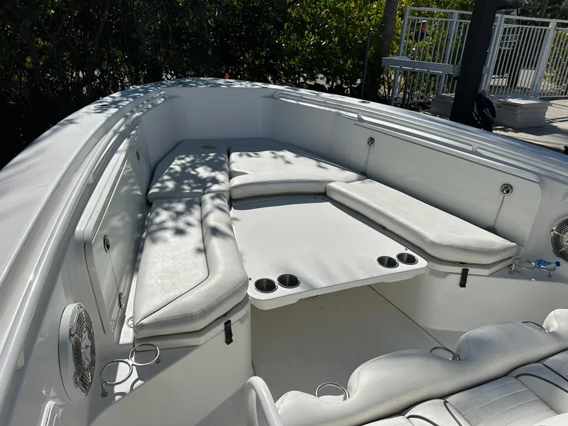 Slide: The Image of 2008 Everglades 350 CC boat interior with cushioned seating and cup holders. - 7