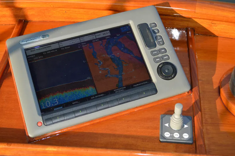 Slide: The Image of Navigation system on 1990 Stanley Downeast Lobster Yacht's wooden dashboard. - 13