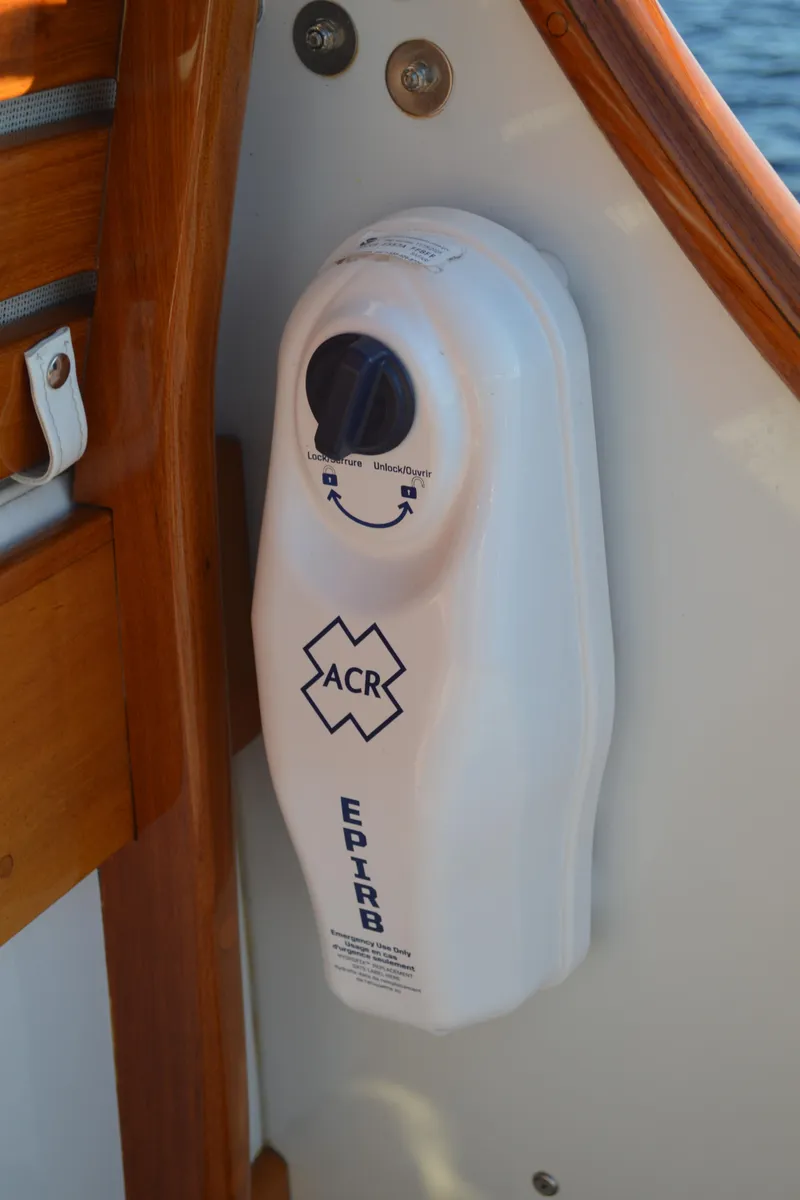 Slide: The Image of EPIRB device on 1990 Stanley Downeast Lobster Yacht, mounted on wooden panel. - 14