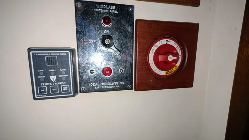 Slide: The Image of Control panels on a 1990 Stanley Downeast Lobster Boat, featuring windlass and battery switches. - 35
