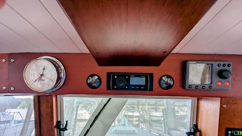 Slide: The Image of Interior dashboard of a 1990 Stanley Downeast Lobster Boat with gauges and controls. - 44