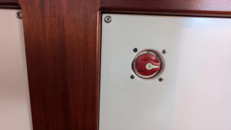 Slide: The Image of Red switch on Stanley Downeast Lobster Boat, 1990 model, with wooden paneling. - 46