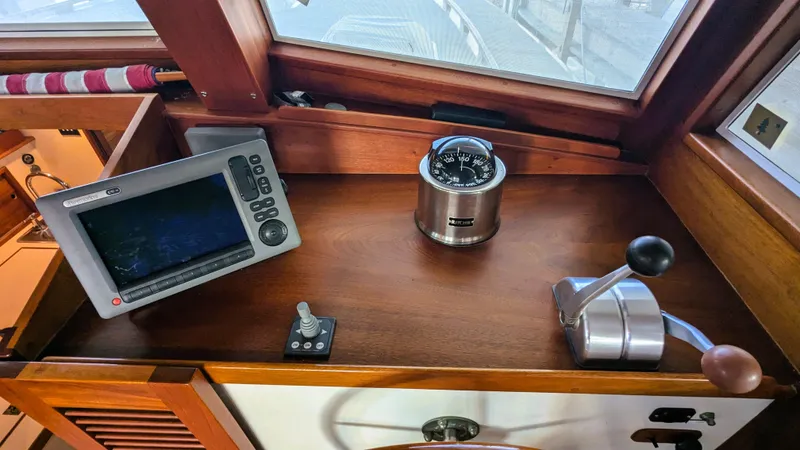 Slide: The Image of 1990 Stanley Downeast Lobster Boat cockpit with navigation equipment and controls. - 48