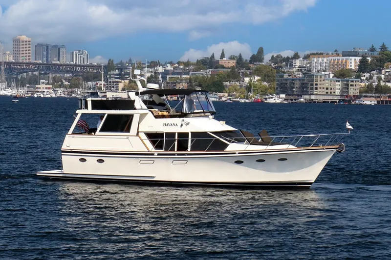 The Image of 1987 Ocean Alexander Motoryacht cruising on a scenic urban waterway. - 0