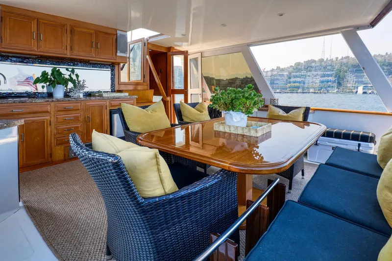 Slide: The Image of Luxurious 1987 Ocean Alexander Motoryacht interior with elegant dining area and scenic water views. - 7