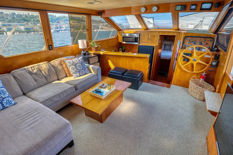 Slide: The Image of Luxurious 1987 Ocean Alexander Motoryacht interior with cozy seating and elegant wood finishes. - 9
