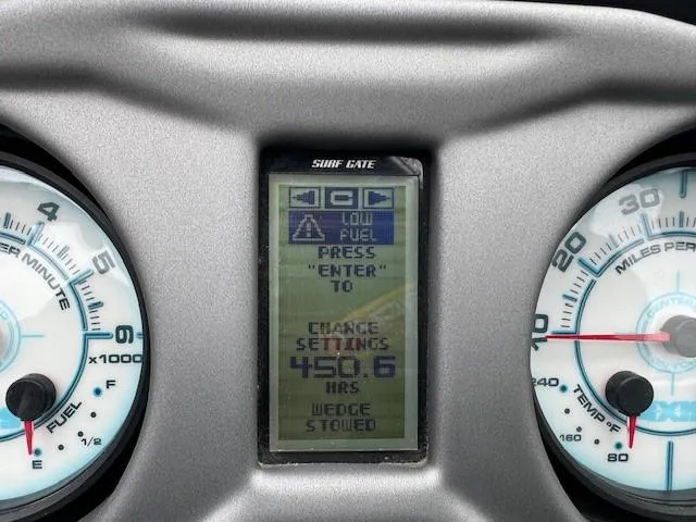 Slide: The Image of Dashboard of 2018 Axis A22 boat showing low fuel warning and engine hours. - 20