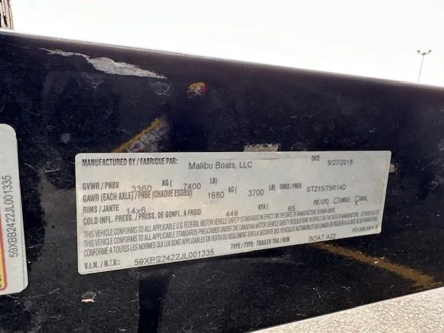 Slide: The Image of 2018 Axis A22 boat label with specifications and manufacturer details. - 22