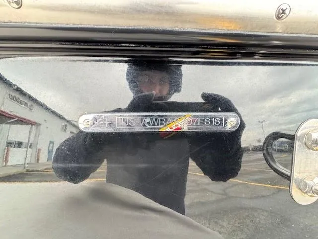 Slide: The Image of 2018 Axis A22 boat with visible identification plate and reflection. - 23