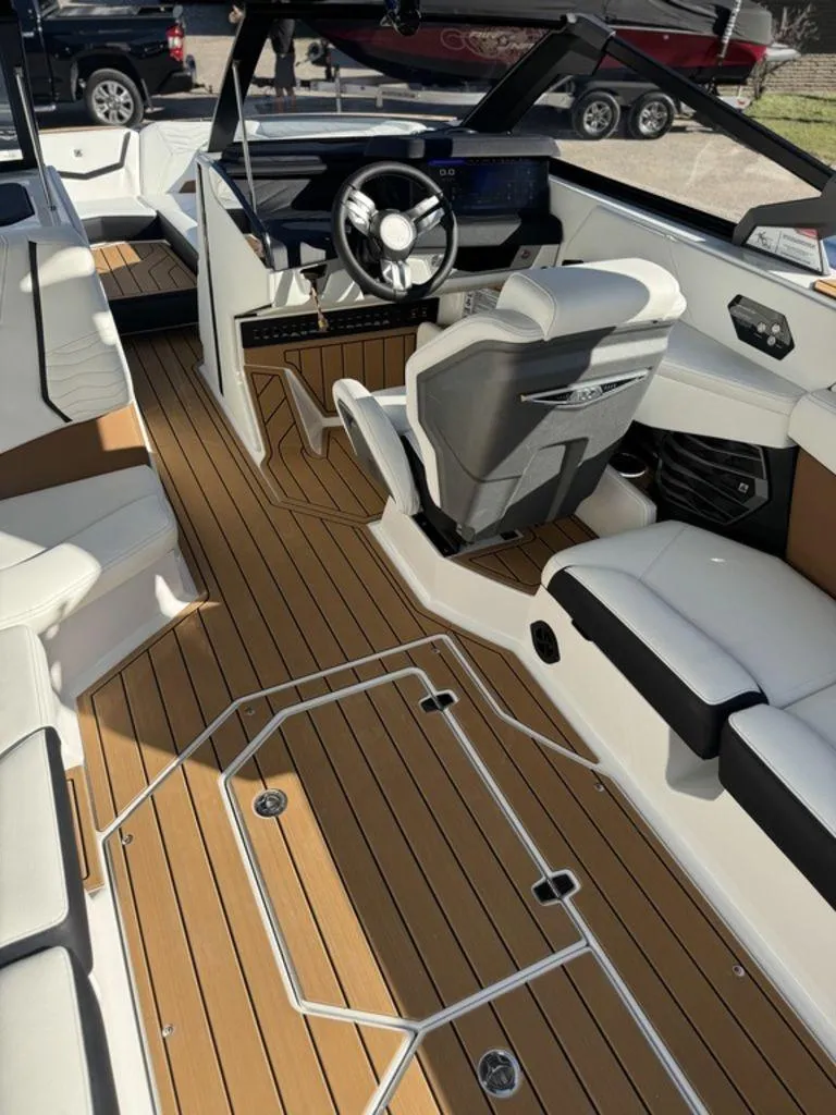 Slide: The Image of 2025 Nautique Super Air Nautique G25 interior with sleek design and modern dashboard. - 10