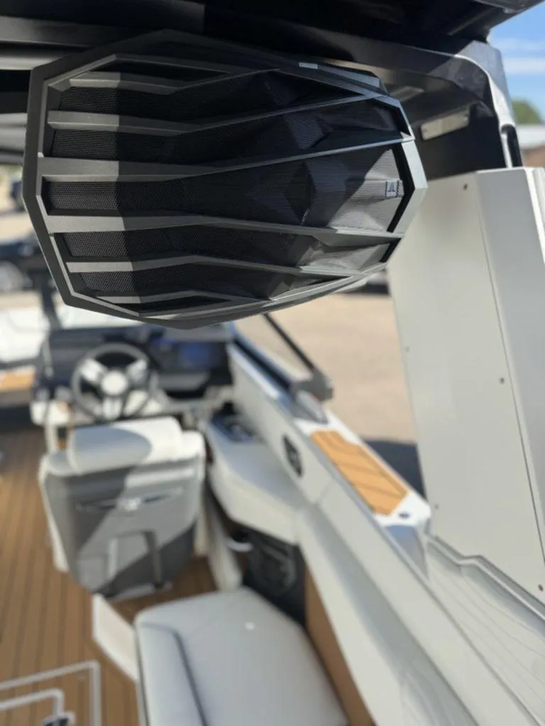 Slide: The Image of 2025 Nautique Super Air Nautique G25 interior with speaker and seating detail. - 11
