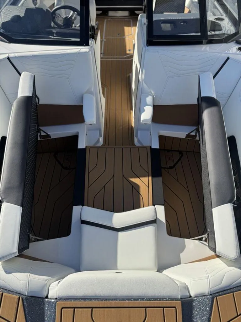 Slide: The Image of 2025 Nautique Super Air Nautique G25 interior with sleek seating and modern design. - 19