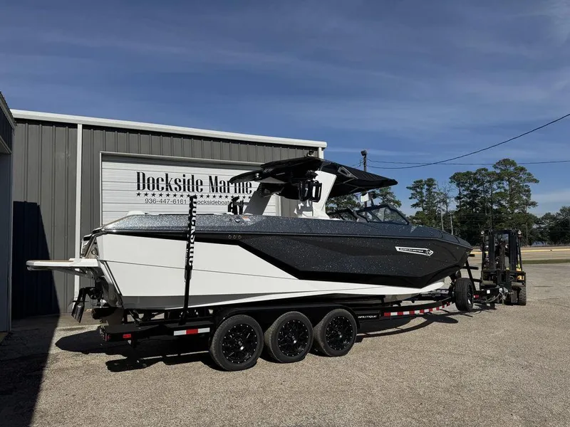 Slide: The Image of 2025 Nautique Super Air Nautique G25 boat on trailer at Dockside Marine. - 2