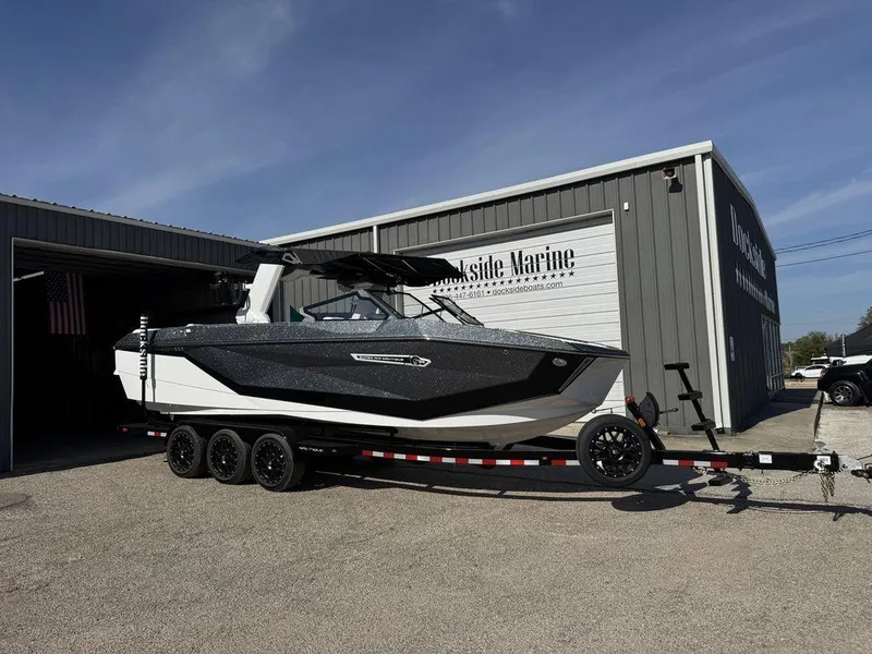 Slide: The Image of 2025 Nautique Super Air Nautique G25 boat on trailer outside Dockside Marine. - 3