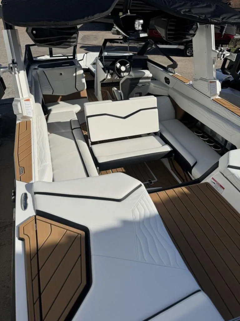 Slide: The Image of 2025 Nautique Super Air Nautique G25 interior with luxurious seating and modern design. - 4