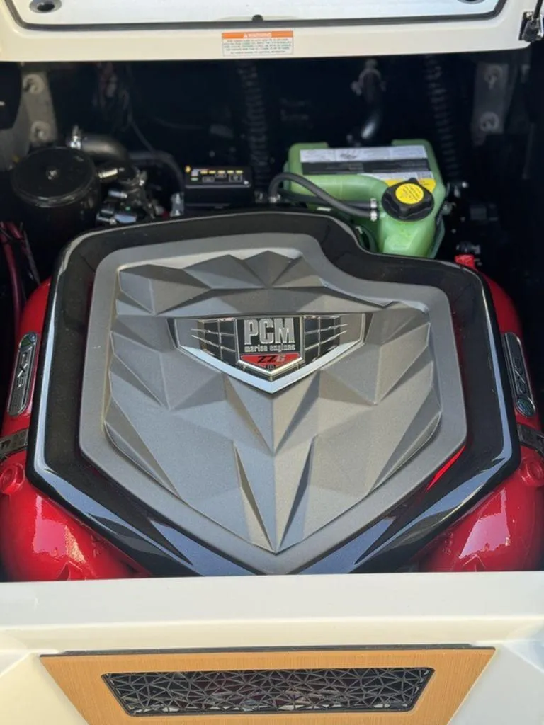 Slide: The Image of 2025 Nautique Super Air Nautique G25 engine compartment with PCM engine cover. - 8