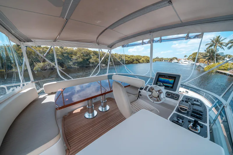 Slide: The Image of Interior view of 2018 Azimut Magellano 53 yacht with modern helm and seating. - 10