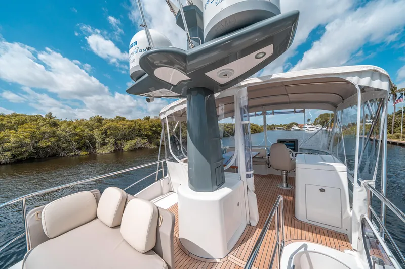 Slide: The Image of 2018 Azimut Magellano 53 yacht deck with seating and navigation equipment. - 17