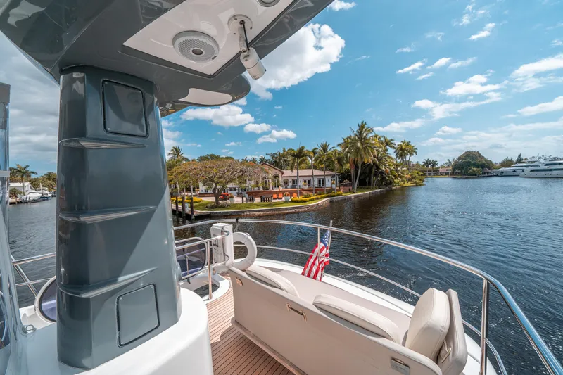 Slide: The Image of Azimut Magellano 53 yacht cruising near tropical waterfront homes, 2018 model. - 21