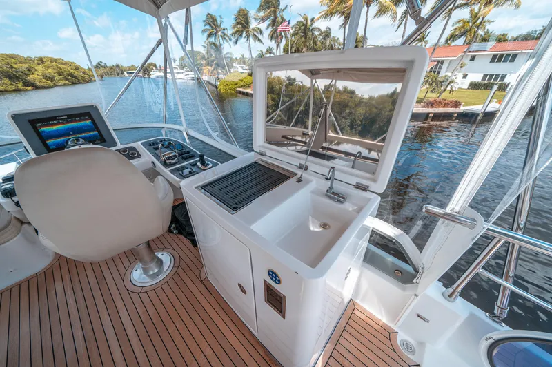 Slide: The Image of Azimut Magellano 53 yacht interior with helm, sink, and grill, 2018 model. - 23