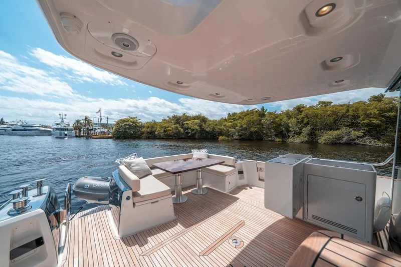 Slide: The Image of Azimut Magellano 53 yacht deck, 2018 model, with luxurious seating and scenic water view. - 27