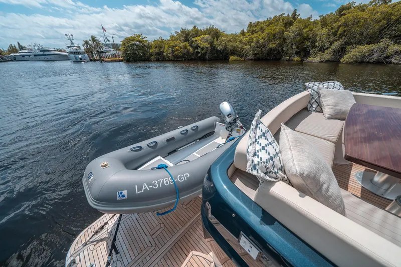 Slide: The Image of Azimut Magellano 53 yacht with inflatable boat on serene water, 2018 model. - 32