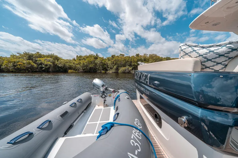 Slide: The Image of Azimut Magellano 53 yacht with inflatable boat on calm water, 2018 model. - 33