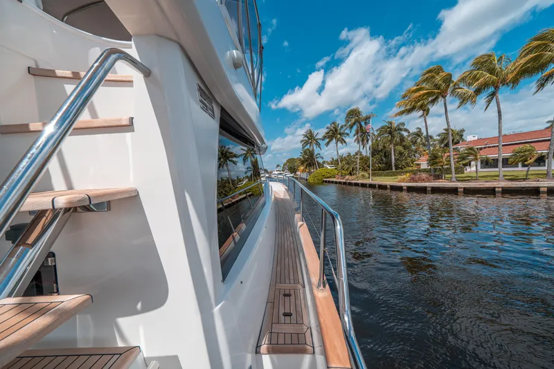Slide: The Image of Azimut Magellano 53 yacht cruising along a scenic waterway, 2018 model. - 37