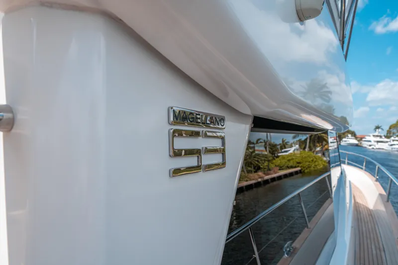 Slide: The Image of Azimut Magellano 53 yacht, 2018 model, docked by a scenic waterfront. - 38