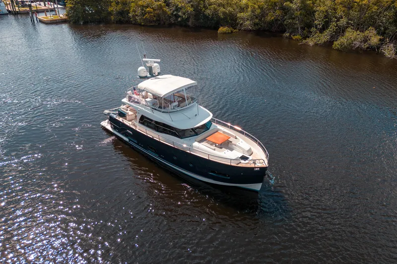 Slide: The Image of 2018 Azimut Magellano 53 yacht cruising on a calm river. - 4
