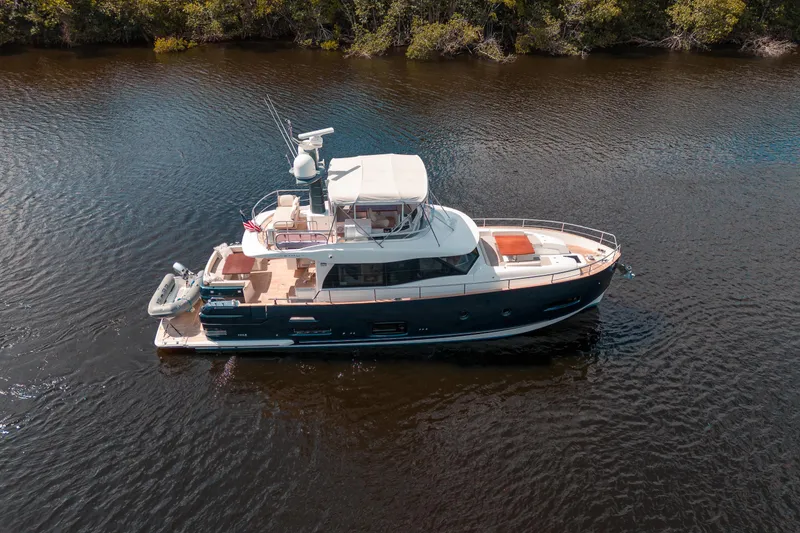 Slide: The Image of 2018 Azimut Magellano 53 yacht cruising on a calm river. - 5