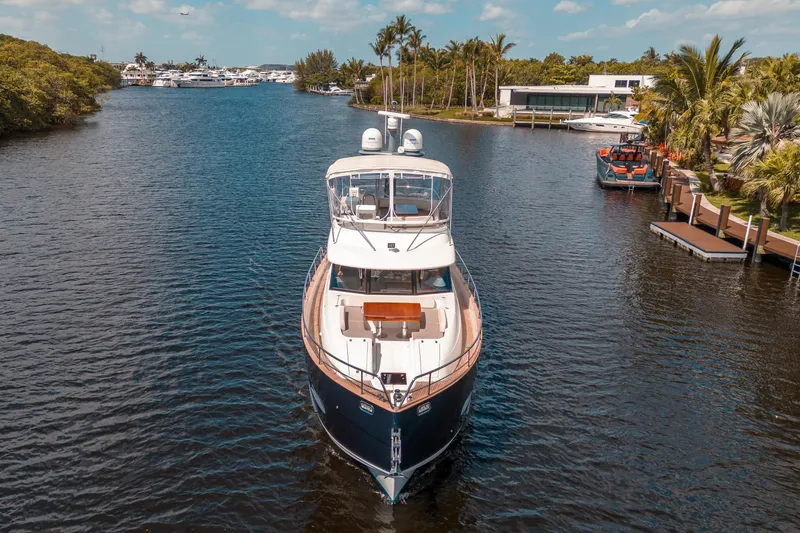 Slide: The Image of 2018 Azimut Magellano 53 yacht cruising on a scenic waterway. - 6