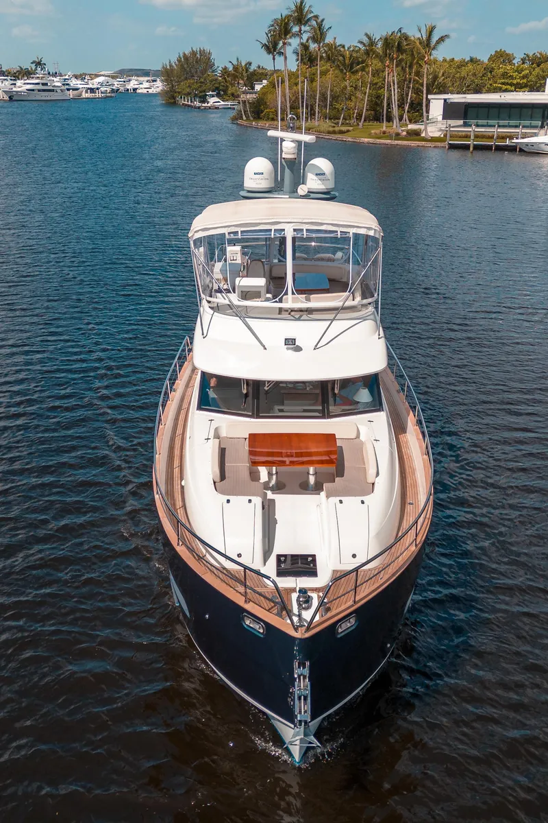 Slide: The Image of 2018 Azimut Magellano 53 yacht cruising on a serene waterway. - 7