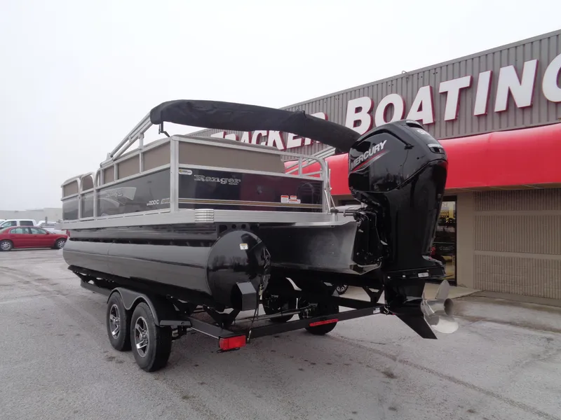 Slide: The Image of 2023 Ranger Reata 200C pontoon boat with Mercury outboard motor at dealership. - 40