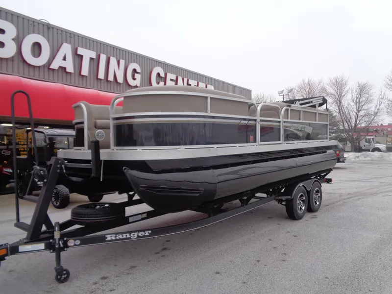Slide: The Image of 2023 Ranger Reata 200C pontoon boat on trailer at boating center. - 41